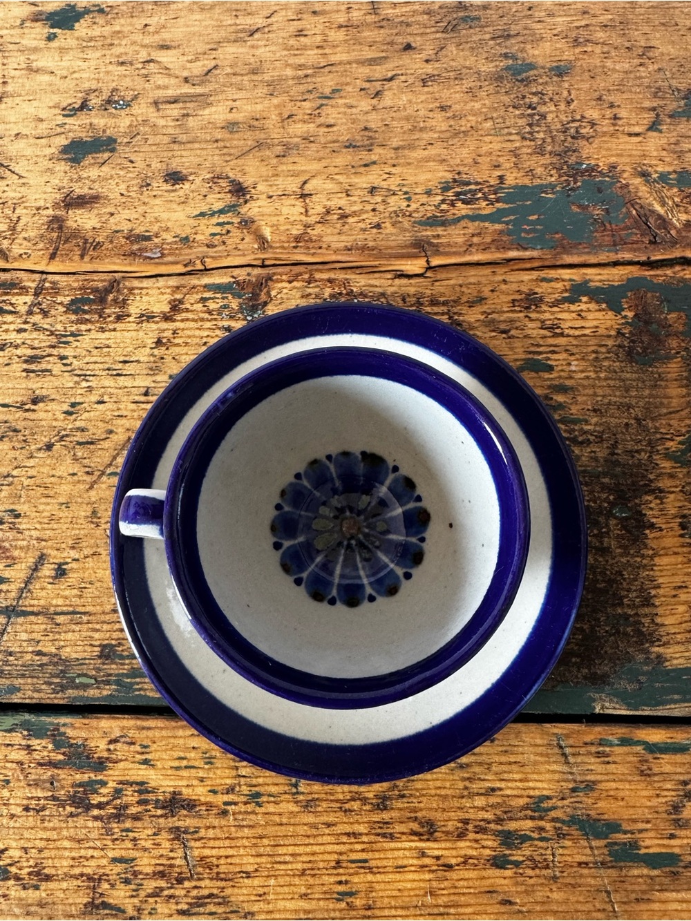 Hand-Painted Blue and White Ceramic Cup & Saucer - Decorative Floral Center